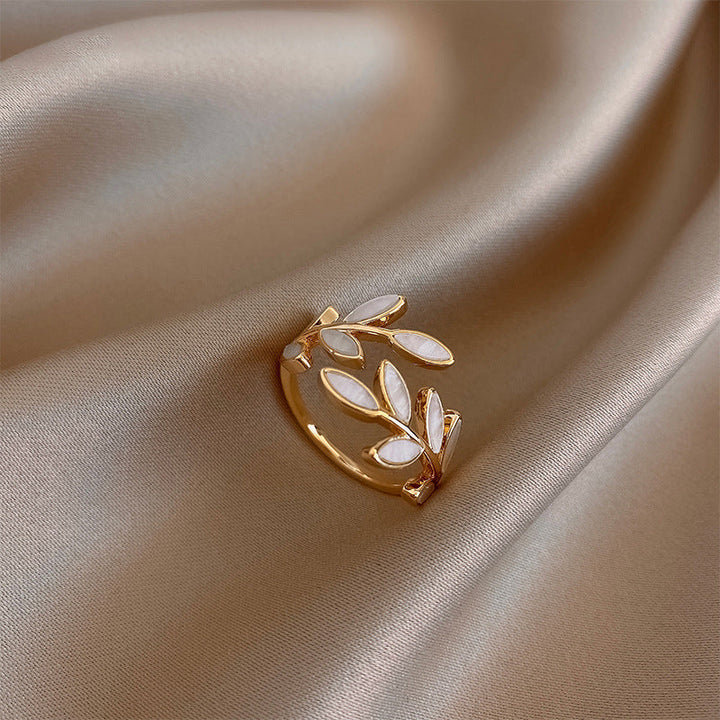 Adjustable gold ring with leaf and white opal